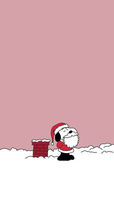 a cartoon santa claus is holding a brick wall in the snow with his hand on it