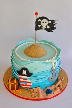 a birthday cake with a pirate flag on top