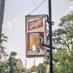 a sign hanging off the side of a pole