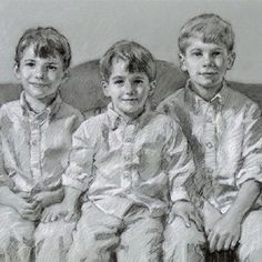 three children sitting side by side on a couch