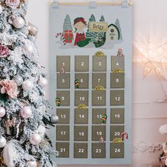 a christmas tree next to a calendar on a wall