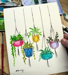 a drawing of hanging plant pots with plants painted on the front and side, in watercolors