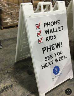 a sign that says phone wallet kids phew see you next week on it