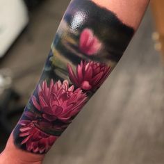 a person with a flower tattoo on their arm