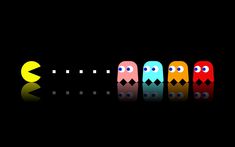 four pacman are lined up in the dark