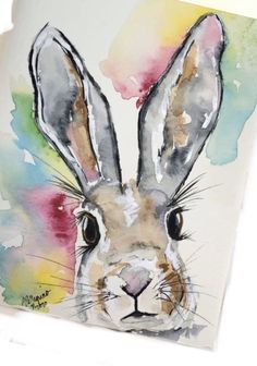 a watercolor painting of a rabbit's face