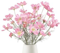 a white vase filled with pink flowers on top of a table