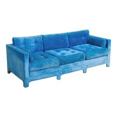 a blue couch sitting on top of a white floor