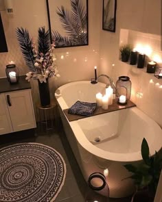 a bathroom with candles on the bathtub