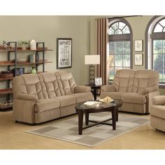 a living room with two couches and a coffee table in front of a window