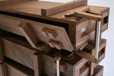 a close up of a wooden cabinet with drawers