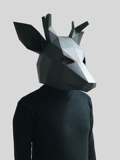 a person wearing a paper animal mask on top of their head and black turtle neck sweater