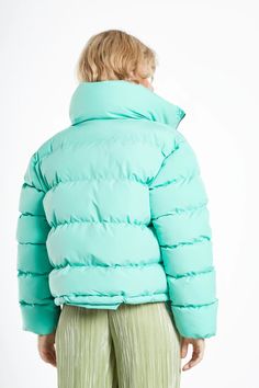 Glamorous Jade Green Padded Puffer Jacket.This puffer jacket will be your go to piece for this up and coming autumn season. With and oversized collar and drawstring features to keep the cold out, this is a stylish but practical piece. Composition: Shell: 100% Polyester, Lining 100% Polyester Model Wears Size 10. Model Height: 5'10''. Trendy Puffer Outerwear For Cold Weather, Trendy Puffer Jacket For Cold Weather, Green Down Puffer Outerwear, Green Down Puffer Jacket For Streetwear, Green Down Puffer Jacket, Green Down Puffer Jacket With Padded Collar, Green Nylon Puffer Jacket With Padded Collar, Green Nylon Puffer Outerwear, Green Nylon Puffer Jacket For Fall