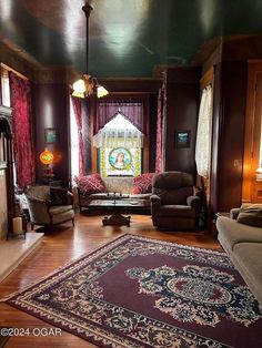 a living room filled with furniture and a large rug