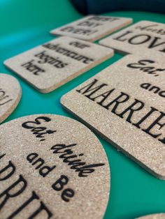 personalized cork coasters with names and words on them are arranged on a table