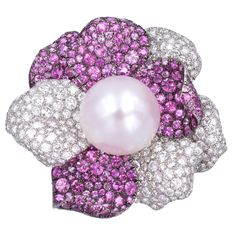 Beautiful blossoming floral design brooch, Impressive 19.1mm pearl surrounded with petals incrusted with diamond & pink sapphire. Estimated weight of diamonds is 11.53cts Estimated weight of pink sapphires is 15.72cts Set in 18k white gold. Signed: DE GRISOGONO # 331101041 Sapphire Brooch, Marquise Shape Diamond, Expensive Jewelry Luxury, Pearl Jewellery, Diamond Brooch, Expensive Jewelry, Gold Brooches, Pearl Brooch, Flower Clip