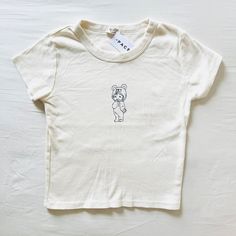 Bnwt Brandy Melville/John Galt Angel Baby Cherub Teddy Bear Pajama Cream Ashlyn Graphic T-Shirt Thick Cotton Kewpie 17 X 13 Cute Cream Loungewear Tops, Cute Cream Tops For Loungewear, Cute White Organic Cotton Tops, Cream Short Sleeve Top For Playtime, Fitted Short Sleeve Bedtime Top, Fitted Cotton Top For Bedtime, Unisex Cute Tops For Loungewear, White Unisex Tops For Loungewear, Teddy Bear Onesie