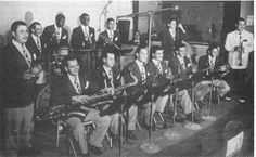 a group of men in suits and ties playing instruments