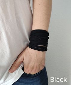 This is versatile wrist cuff bracelet in black - CHOOSE YOUR COLOR from the drop down menu - visit my shop for more colors *Handmade from stretchy, soft cotton jersey *Fabulous accessory for your outfit *Goes well with everything *One skinny t-shirt strand *Can be worn as bracelets, necklaces or a belt *Can be wrapped around wrist up to 10 times - depends on your wrist circumference *Every bracelet is made by me. COLOR: Colors available in the drop down menu MATERIALS: soft cotton jersey SIZE: o Adjustable Band Bracelets For Everyday, Everyday Black Bracelets With Wrist Strap, Handmade Black Band Bracelet, Black Cuff Wristband As Gift, Casual Black Band Wristband, Handmade Black Cuff Bracelets, Handmade Black Cuff Wristband, Adjustable Black Band Cuff Bracelet For Everyday, Black Adjustable Band Bracelet