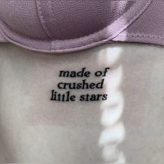 the back of a woman's shirt that reads, made of crushed little stars