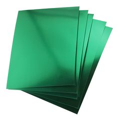 green paper is stacked on top of each other