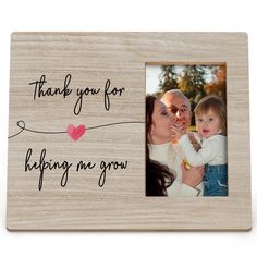 a wooden photo frame with the words thank you for helping me grow and a heart