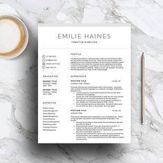 a clean and modern resume template on top of a marble table with a cup of coffee