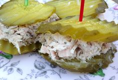 the sandwich is cut in half and ready to be eaten with a toothpick