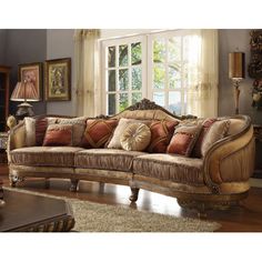 a living room filled with furniture next to a window covered in curtains and windowsills