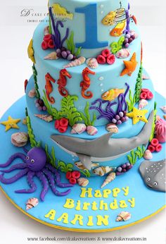 a birthday cake decorated with an ocean theme