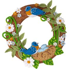 a wreath with flowers and birds on it