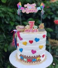 a white cake with colorful decorations on top