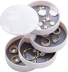 an open jewelry box filled with lots of rings