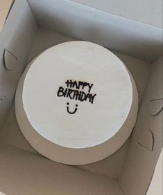 a birthday cake in a box with the words happy birthday written on it