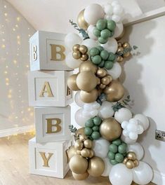 a baby shower is decorated with balloons and garlands