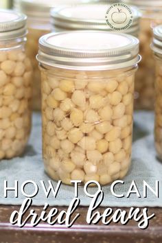 jars filled with beans sitting on top of a table