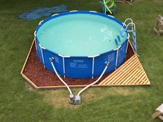 an above ground swimming pool in a backyard