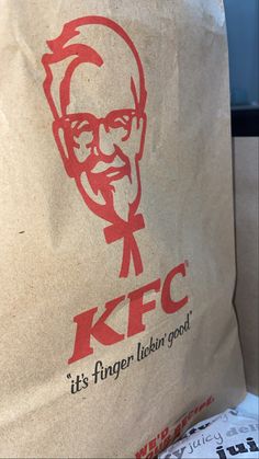 a brown paper bag with a kfc logo on it