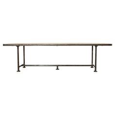 a long table with metal legs and a marble top on an isolated white background for display