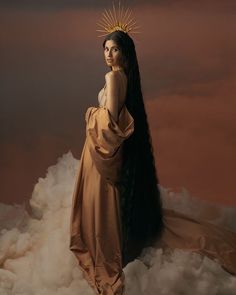 a woman with long black hair standing on clouds