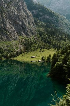 a mountain lake surrounded by lush green trees