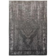 a gray rug with an intricate design on the front and back side, in shades of grey