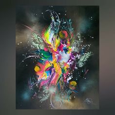 an abstract painting with lots of colors and shapes on it's face, in the dark