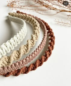 four braided headbands sitting next to each other