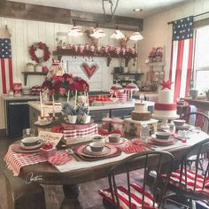 a kitchen decorated for the fourth of july with red, white and blue decorating