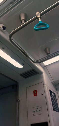 the inside of an airplane with some lights on and no one in it or something else