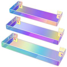 three metal shelfs that have different colors on them