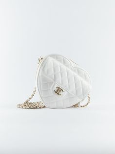 Chanel Heart Bag Large in White Lambskin with Gold Hardware & leather looped crossbody chain. Un & 100% d. Supplied with Chanel box, dustbag, ribbon and ation microchip. Dimensions: 16.5 × 18 × 6.5 cm DETAILSLambskinGold HardwearLarge16.5 × 18 × 6.5 cmNeed assistance? Use our Delivery 5-8 or 10-15 working days Please note that during high season and Sale period, delivery times may be affected We accept payment with a Credit card, Debit card, or PayPal./pages/sourcery">Sourcery service or speak t Chanel Heart Bag, Chanel Box, Heart Bag, Timeless Handbag, Luxe Fashion, Vuitton Bag, Exclusive Bag, Bags Designer Fashion, Large White