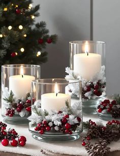 christmas candles are sitting on a table