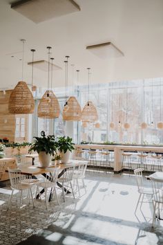 an empty restaurant with tables and chairs